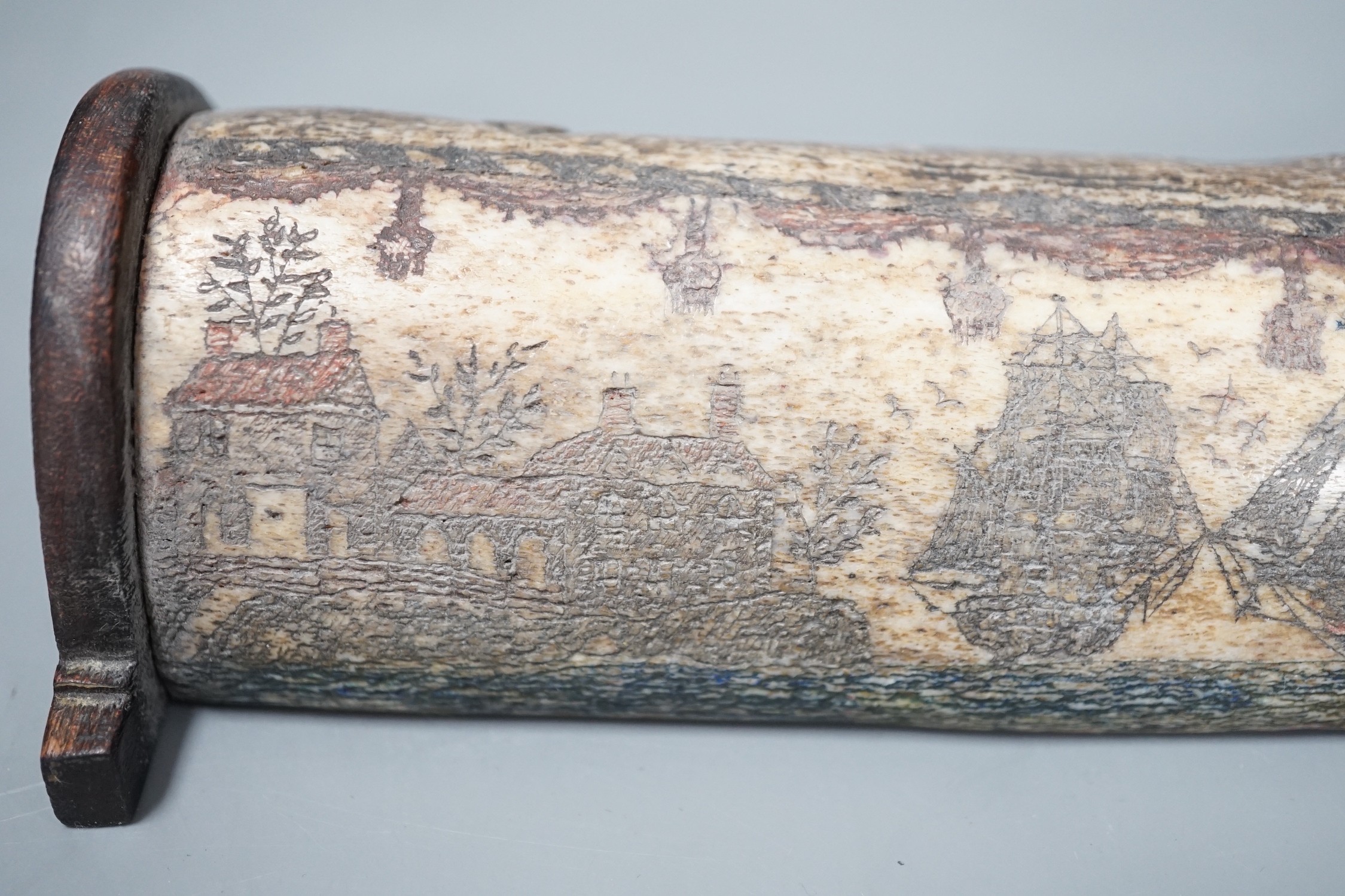 An 18th/early 19th century scrimshaw whale bone carving, 19cm